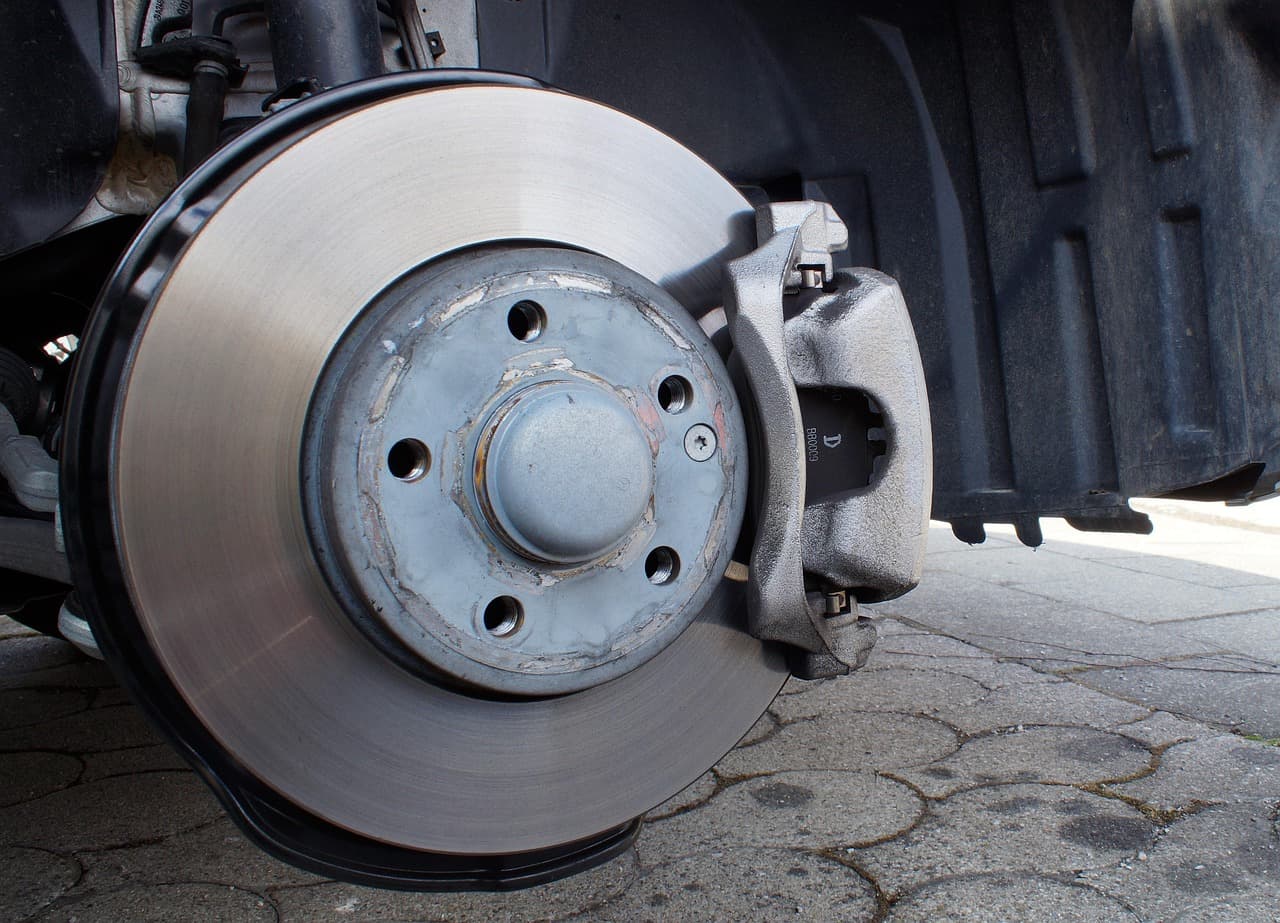 A brake disc and caliper with the wheel off