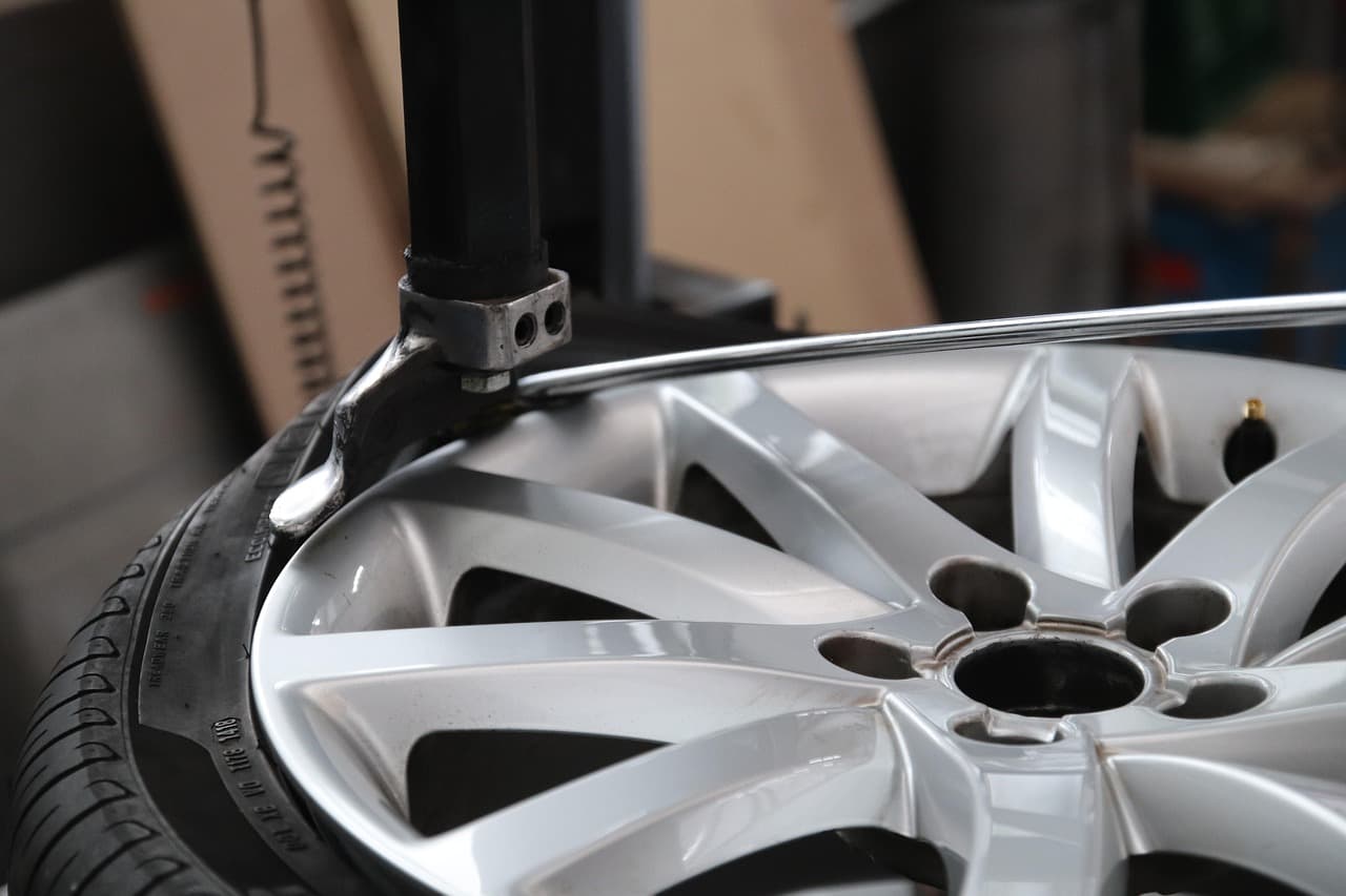 An alloy wheel on a tyre-changing machine